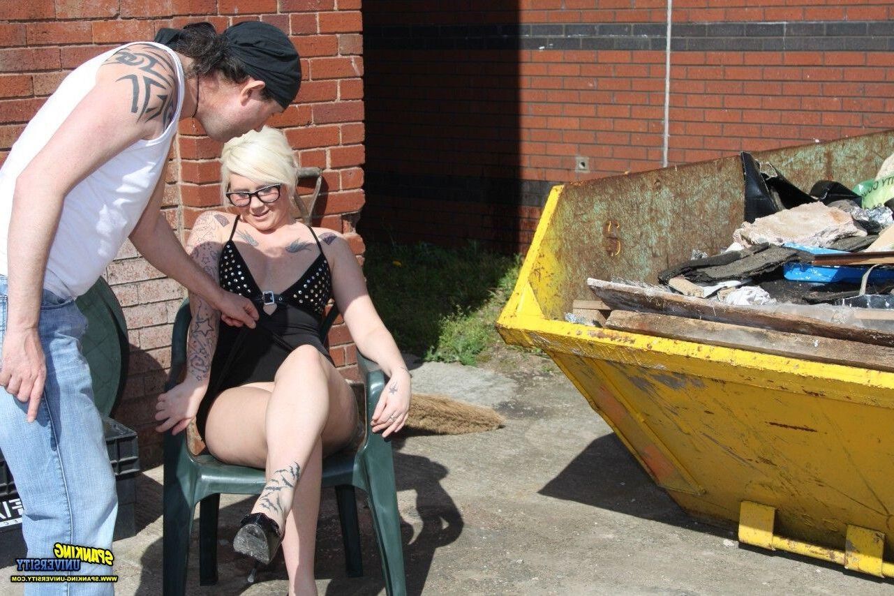 Spanking University outside blonde black dress