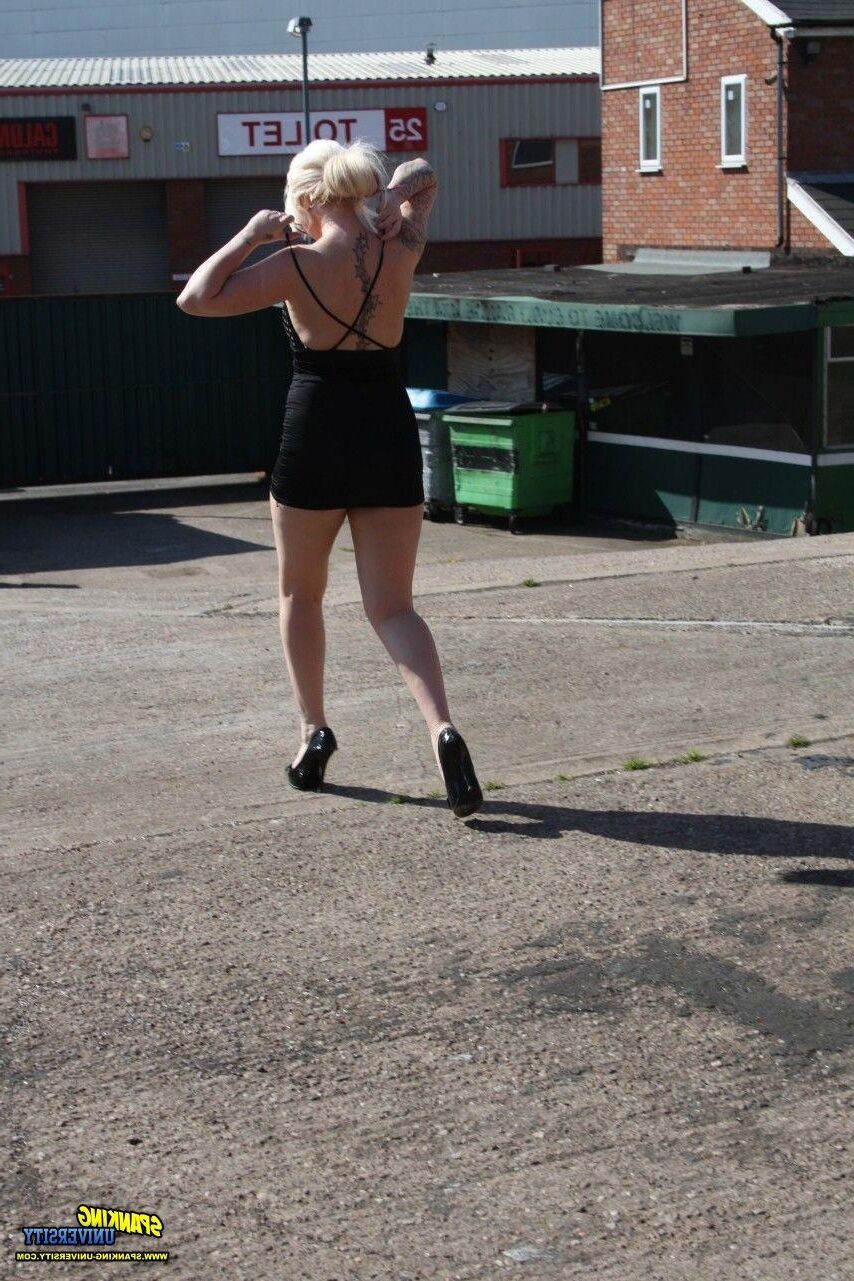 Spanking University outside blonde black dress