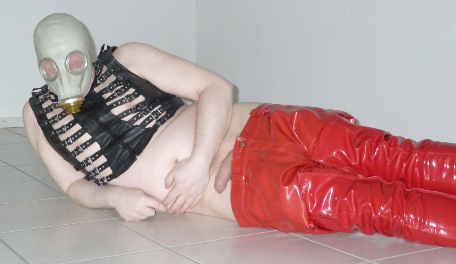 Gas mask and red shiny pants