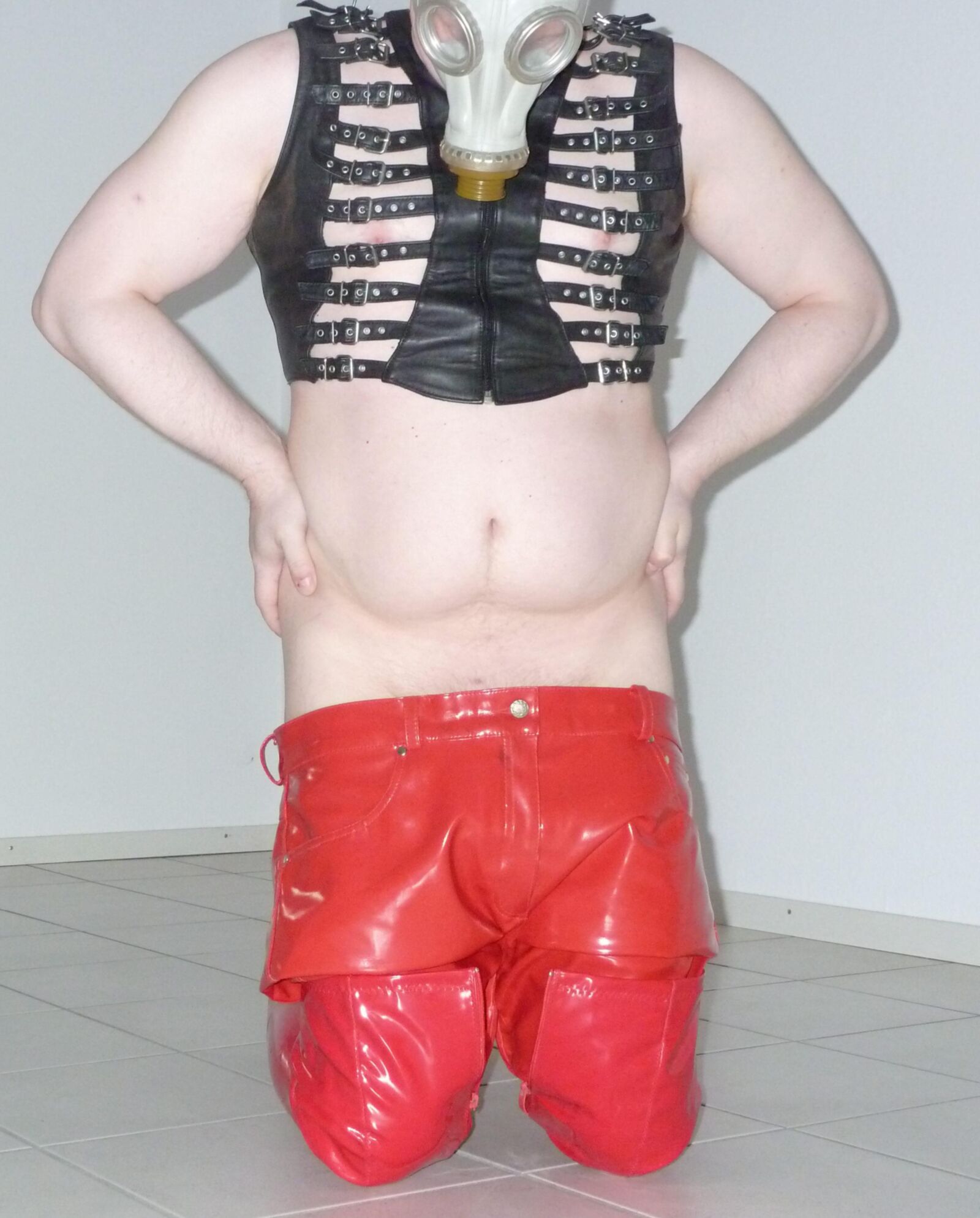 Gas mask and red shiny pants