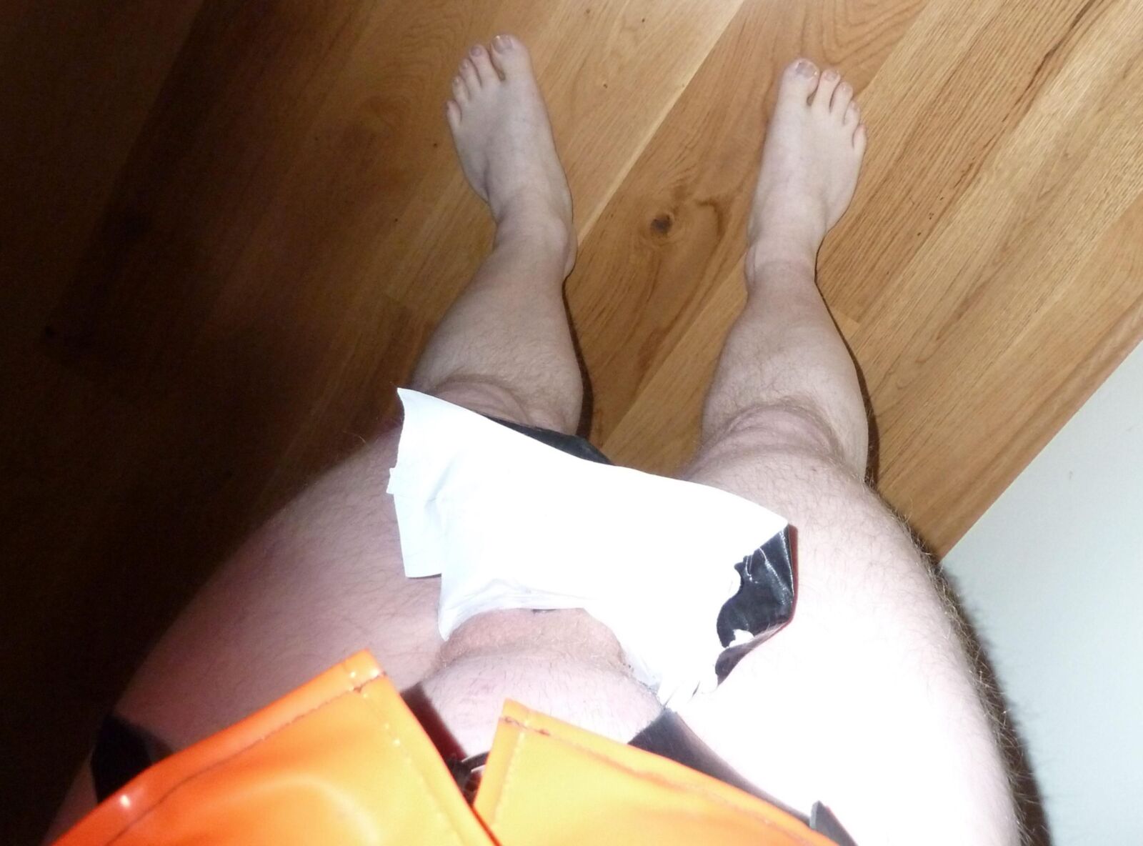 Orange and black fetish gear