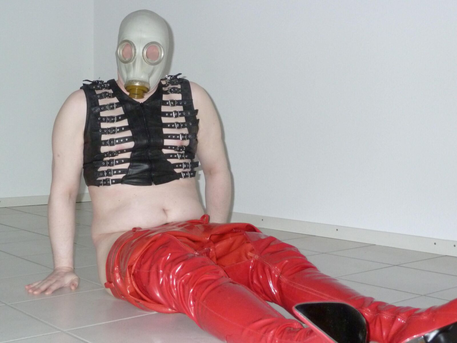 Gas mask and red shiny pants