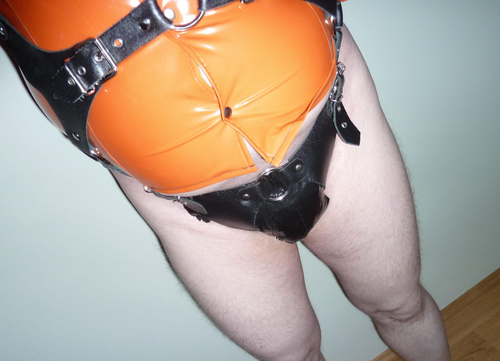 Orange and black fetish gear
