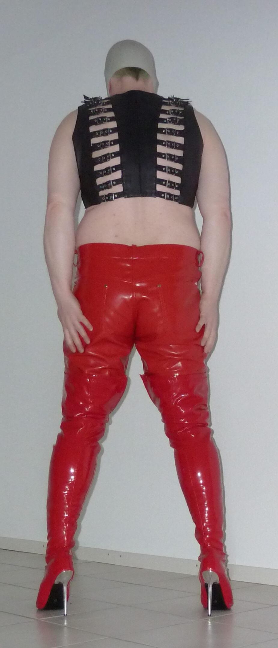 Gas mask and red shiny pants