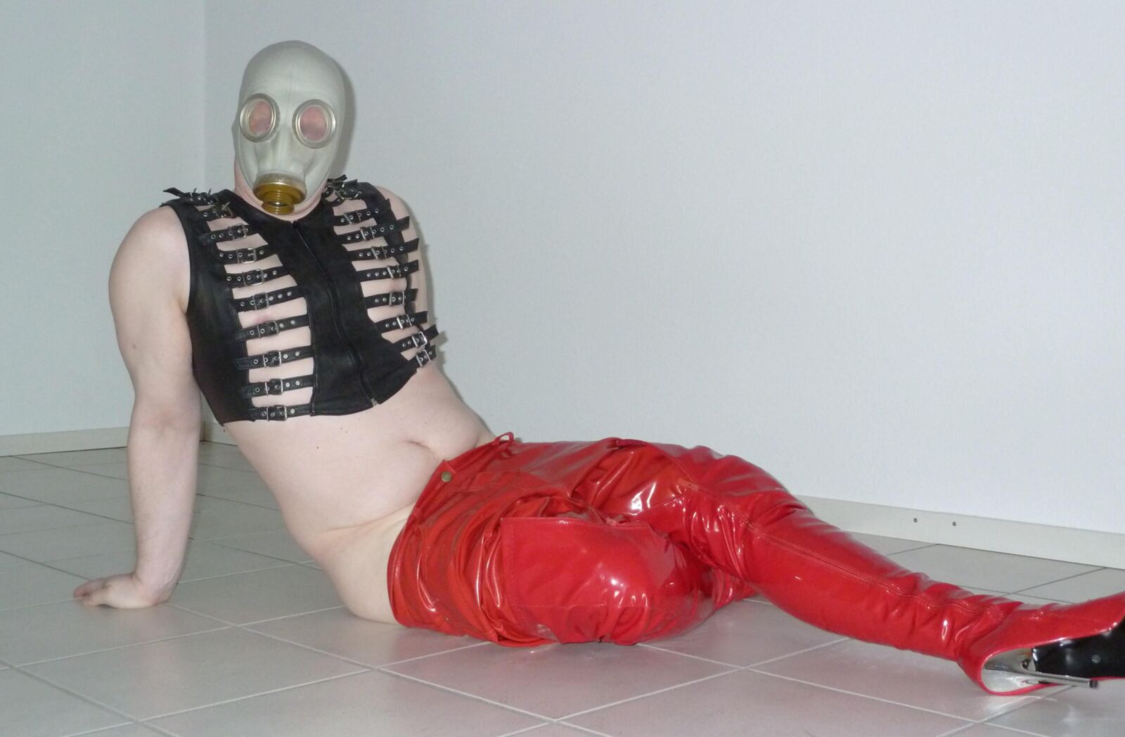 Gas mask and red shiny pants
