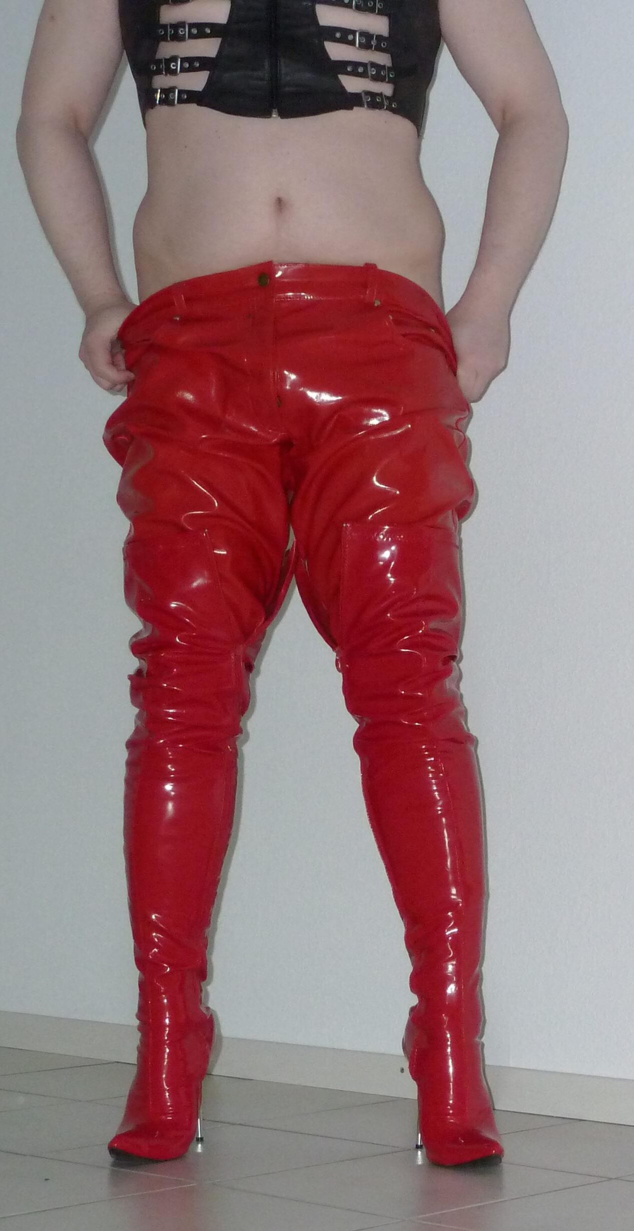 Gas mask and red shiny pants