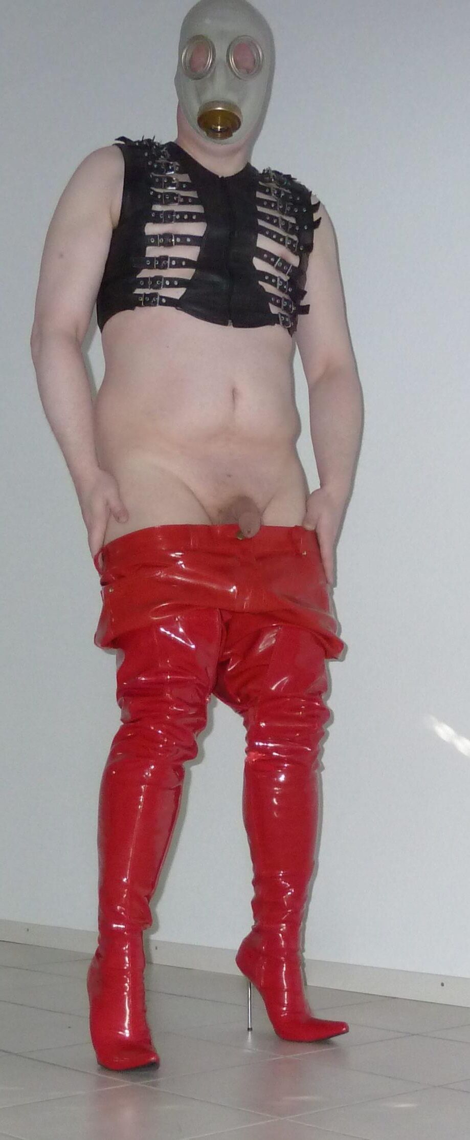 Gas mask and red shiny pants