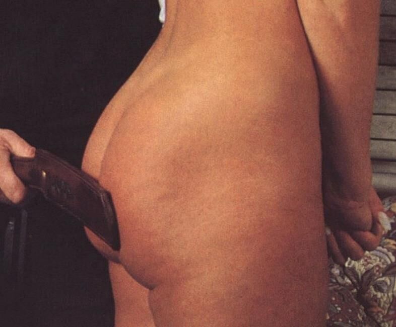 Retro Spanking Februs and Fessee Blonde pink dress spank on sofa