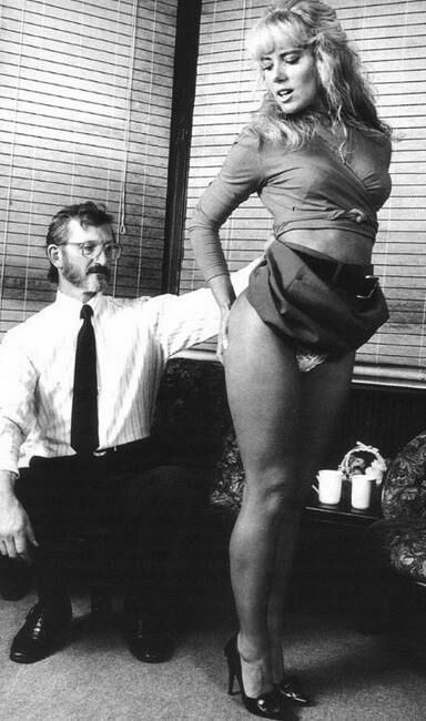 Retro Spanking Februs and Fessee Blonde pink dress spank on sofa
