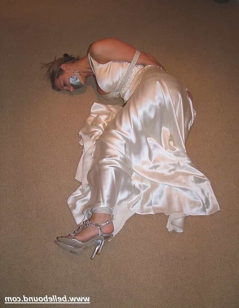 Charlie Dee bound in White Satin Dress