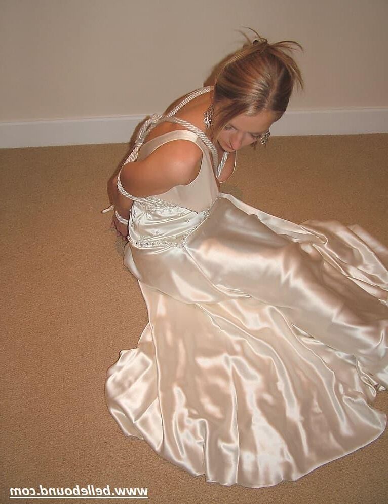 Charlie Dee bound in White Satin Dress