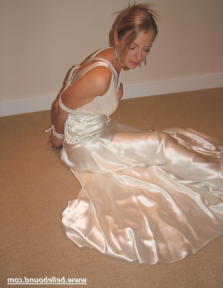 Charlie Dee bound in White Satin Dress