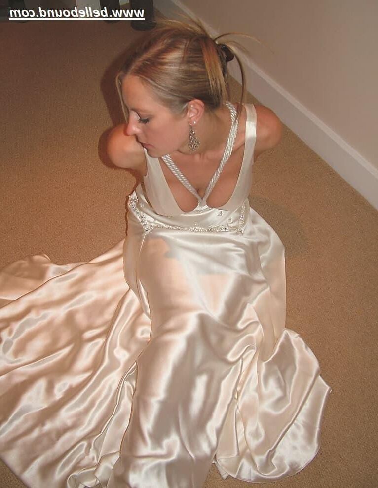 Charlie Dee bound in White Satin Dress