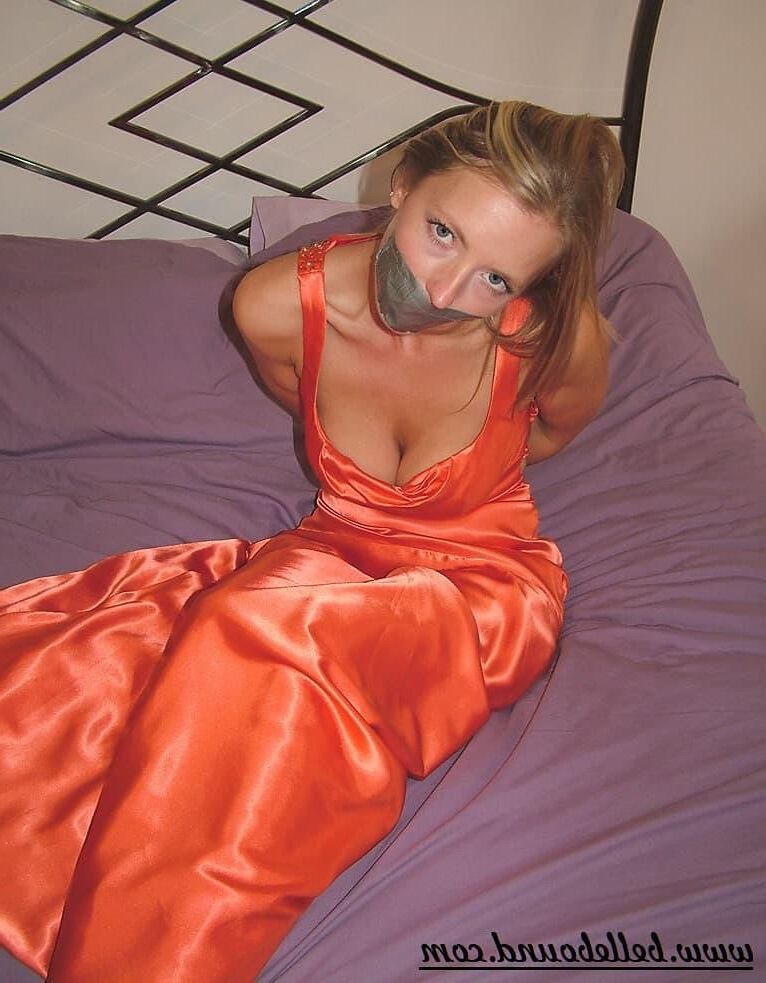 Charlie Dee Bound in Orange Satin Dress