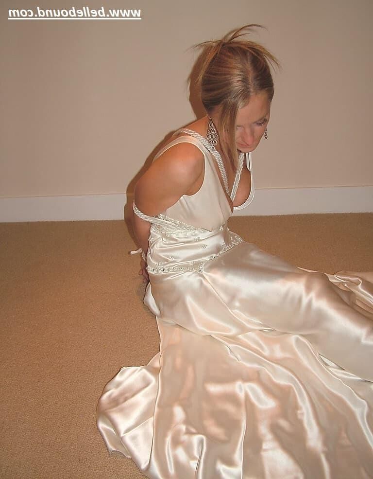Charlie Dee bound in White Satin Dress