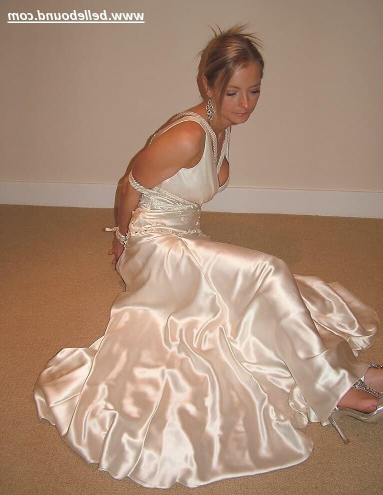 Charlie Dee bound in White Satin Dress