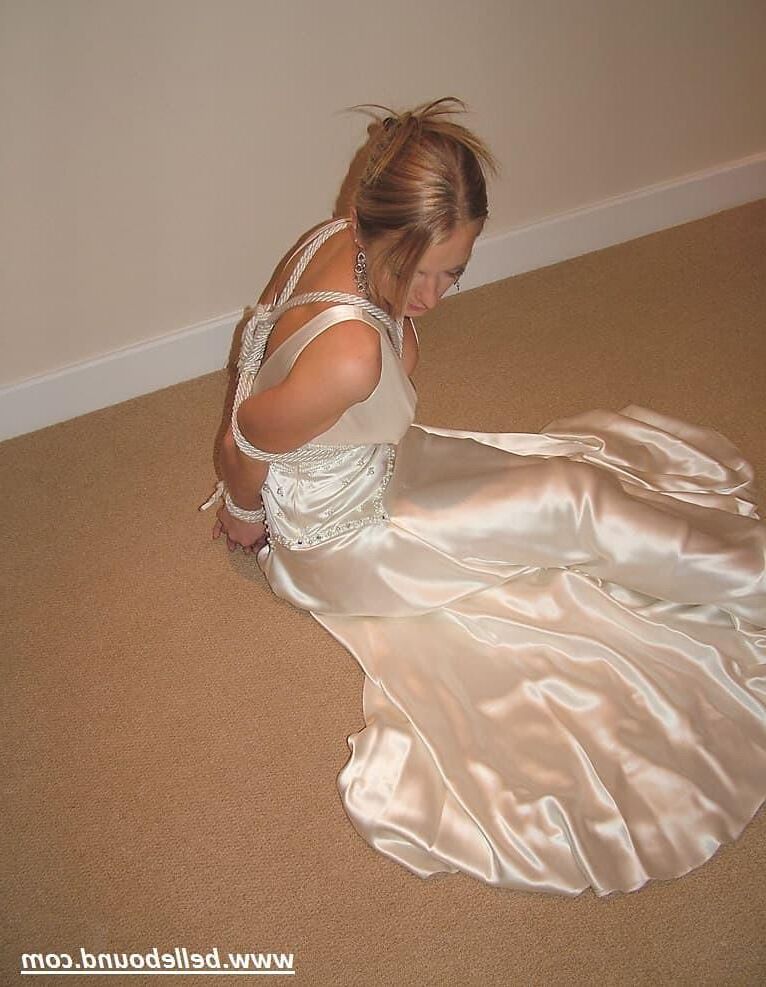 Charlie Dee bound in White Satin Dress